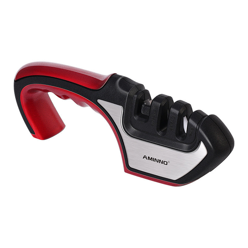 A Four-in-one Family Uses A Sharpener To Sharpen A Kitchen Knife snapshop