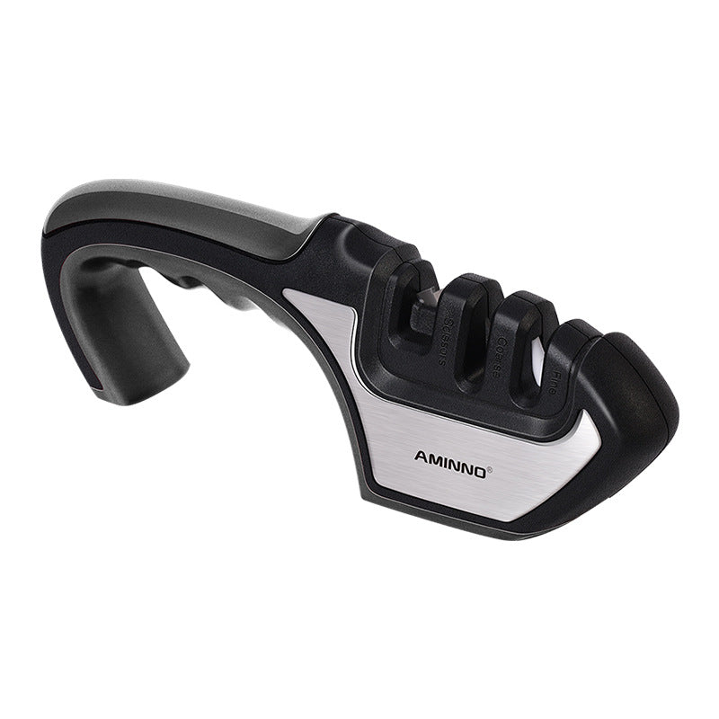 A Four-in-one Family Uses A Sharpener To Sharpen A Kitchen Knife snapshop